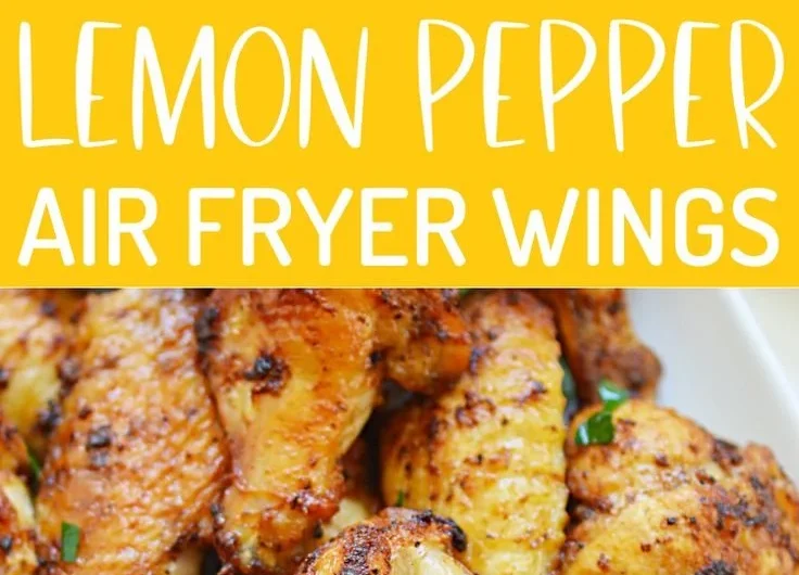 Plate of crispy air fryer lemon pepper wings with lemon slices