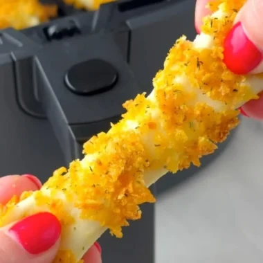 Crispy air fryer mozzarella sticks served with marinara sauce