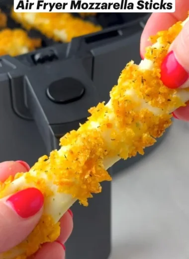 Crispy air fryer mozzarella sticks served with marinara sauce