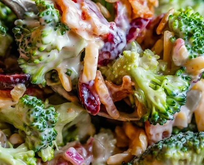 Delicious and healthy broccoli salad with toppings and dressing