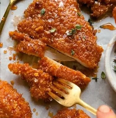Delicious cornflake-crusted chicken served with fresh vegetables.
