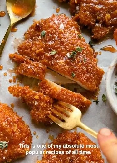 Delicious cornflake-crusted chicken served with fresh vegetables.