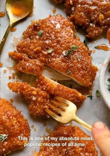 Delicious cornflake-crusted chicken served with fresh vegetables.