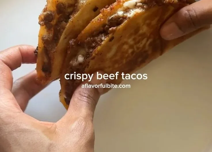 Delicious crispy ground beef tacos served with fresh toppings