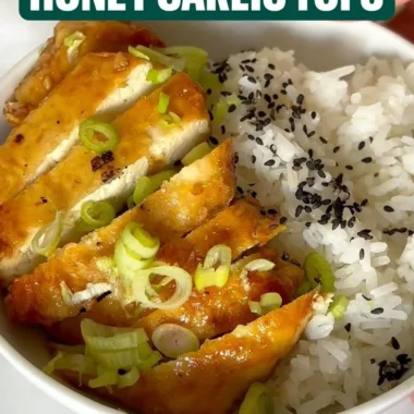 Delicious dish of honey garlic tofu served with vegetables and rice