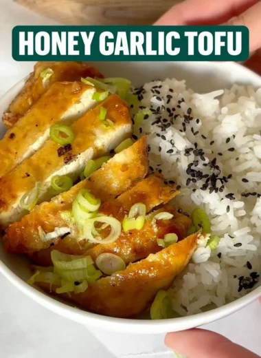 Delicious dish of honey garlic tofu served with vegetables and rice