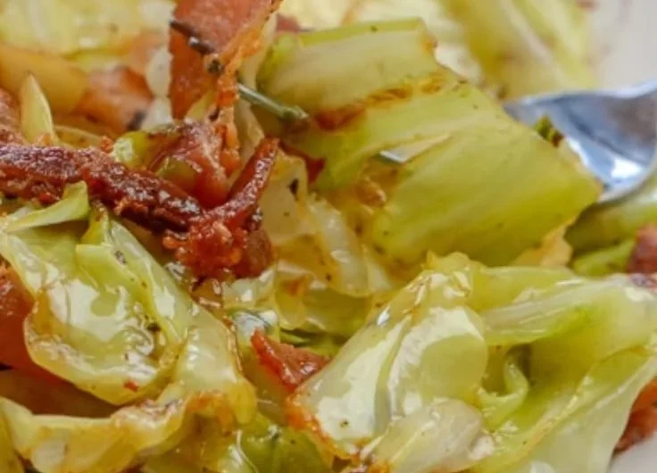 Southern fried cabbage with crispy bacon served in a skillet