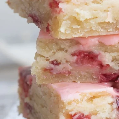 Delicious homemade strawberry bars topped with fresh strawberries