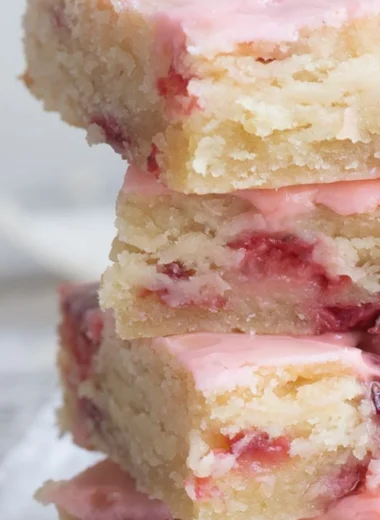 Delicious homemade strawberry bars topped with fresh strawberries