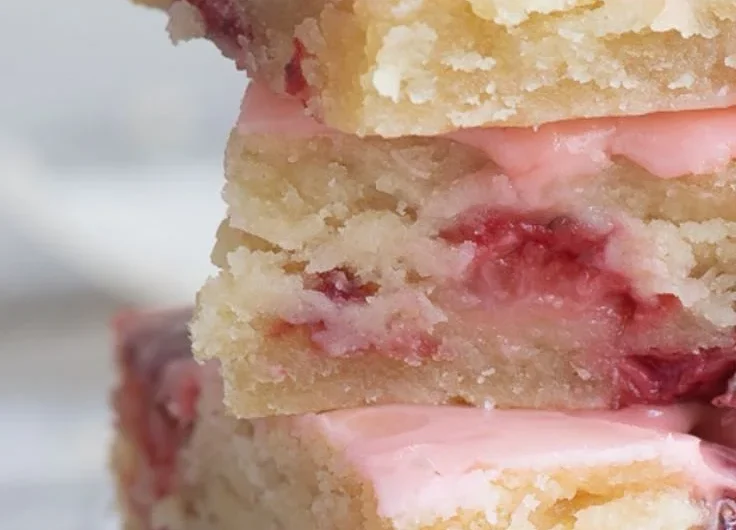 Delicious homemade strawberry bars topped with fresh strawberries