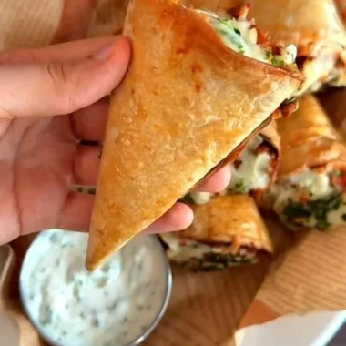 Tortilla cones filled with melted mozzarella cheese.