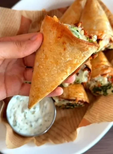Tortilla cones filled with melted mozzarella cheese.