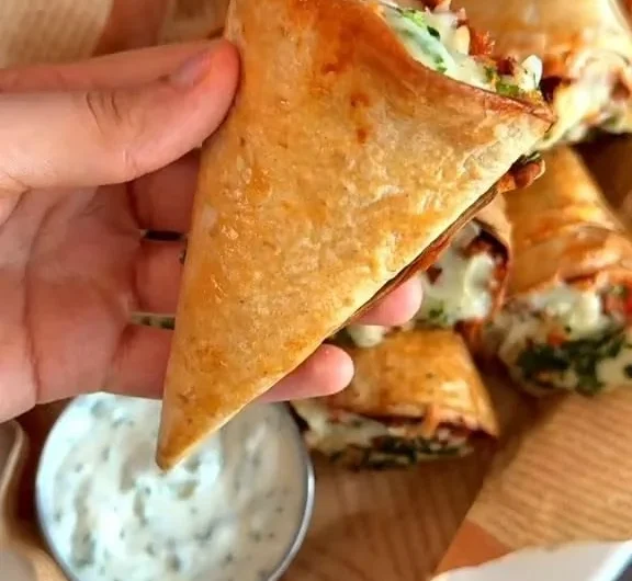 Tortilla cones filled with melted mozzarella cheese.