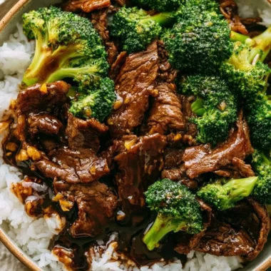 Delicious Beef and Broccoli stir-fry served on a plate with rice.