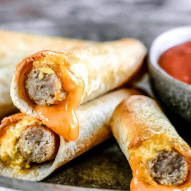 Delicious easy breakfast taquitos filled with eggs and cheese on a plate