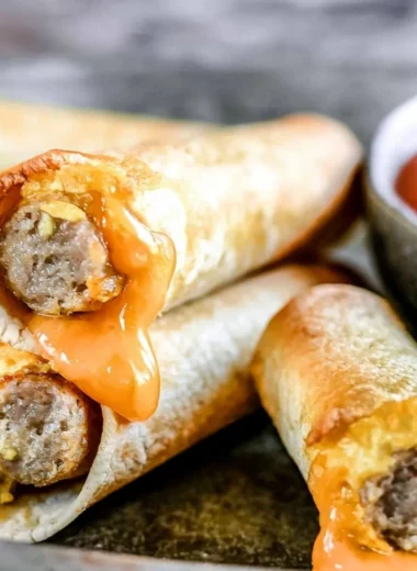 Delicious easy breakfast taquitos filled with eggs and cheese on a plate
