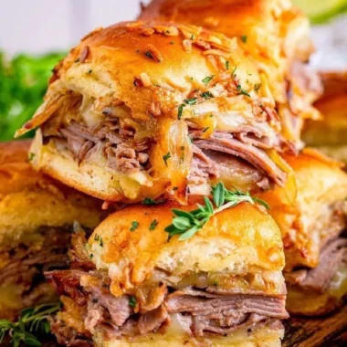 Delicious French Dip Sliders served with rich dipping sauce