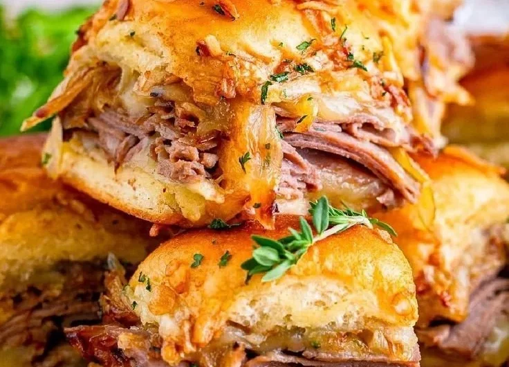Delicious French Dip Sliders served with rich dipping sauce
