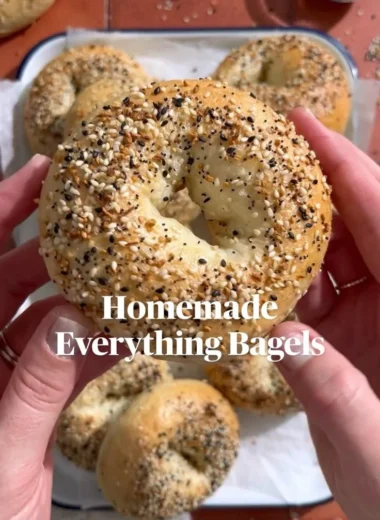Freshly baked homemade everything bagels topped with seeds and seasonings.