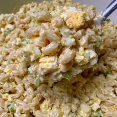 Delicious Mom's Macaroni Salad served in a bowl with colorful vegetables