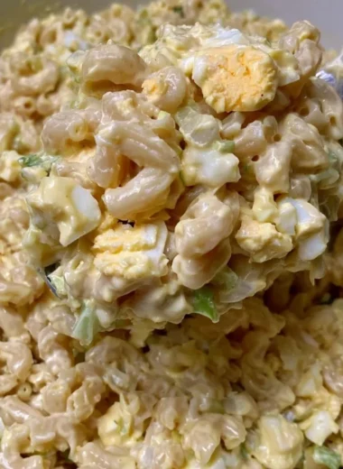 Delicious Mom's Macaroni Salad served in a bowl with colorful vegetables