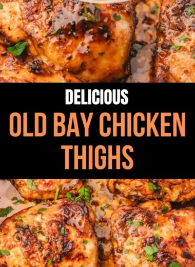 Juicy Old Bay Chicken Thighs garnished with fresh herbs on a plate.