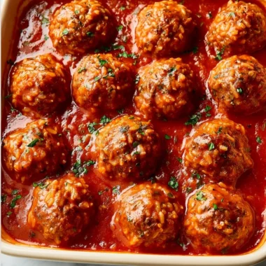 Delicious Porcupine Meatballs served with sauce and herbs on a plate