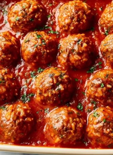 Delicious Porcupine Meatballs served with sauce and herbs on a plate