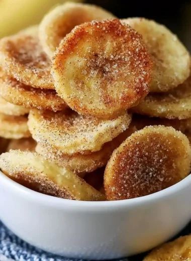 Crispy cinnamon-sugar air fryer banana chips on a plate