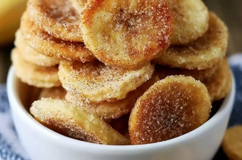 Crispy cinnamon-sugar air fryer banana chips on a plate