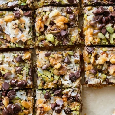 Delicious homemade Seven Layer Bars stacked on a plate
