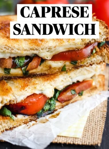 Toasted Caprese Sandwich with fresh mozzarella, tomatoes, and basil on toasted bread.