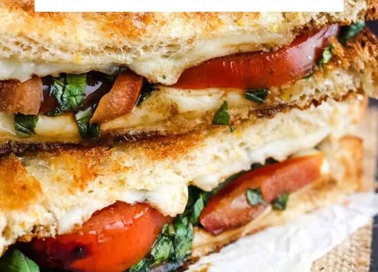 Toasted Caprese Sandwich with fresh mozzarella, tomatoes, and basil on toasted bread.