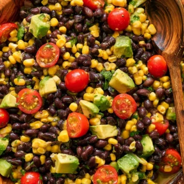 Vegan black bean salad in a bowl with colorful vegetables and herbs