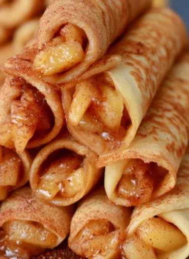 Delicious Apple Cinnamon Crepes topped with fresh apples and cinnamon.