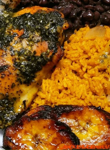 Cozy chicken yellow rice with black beans served in a colorful bowl