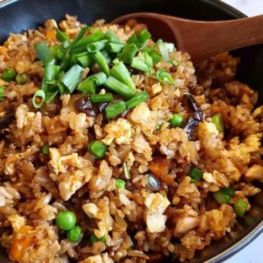Cozy Chinese Egg Fried Rice garnished with vegetables and herbs