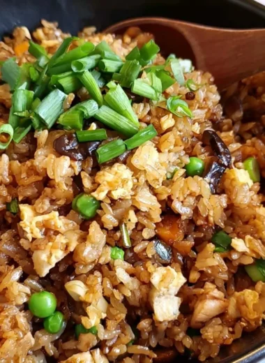 Cozy Chinese Egg Fried Rice garnished with vegetables and herbs