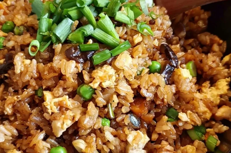 Cozy Chinese Egg Fried Rice garnished with vegetables and herbs