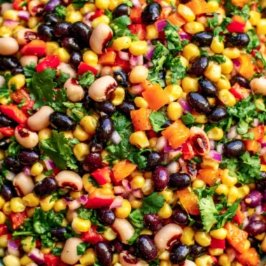 Bowl of Cozy Cowboy Caviar with fresh vegetables and black beans
