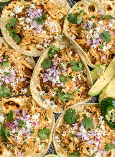 Delicious crockpot chicken tacos served on a wooden table