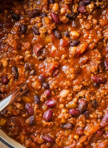 Bowl of cozy ground turkey chili topped with fresh herbs