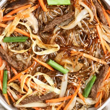 Delicious bowl of Japchae, Korean stir-fried noodles with colorful vegetables