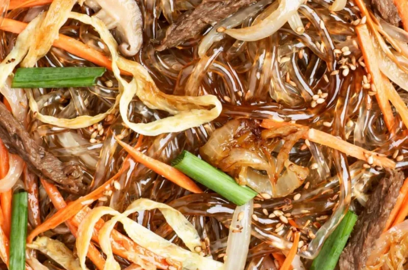 Delicious bowl of Japchae, Korean stir-fried noodles with colorful vegetables