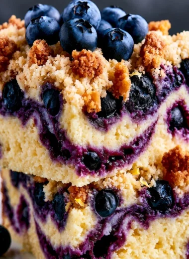 Cozy lemon blueberry cake with fresh blueberries and lemon zest on a plate