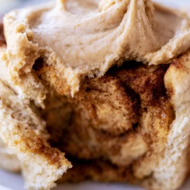 Delicious pumpkin cinnamon rolls drizzled with buttery frosting