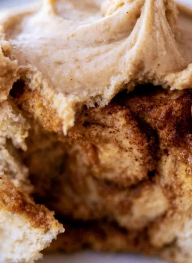 Delicious pumpkin cinnamon rolls drizzled with buttery frosting