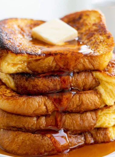 Delicious plate of easy French toast with syrup and fresh berries for breakfast