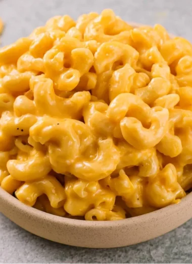 Delicious homemade mac and cheese served with a golden, cheesy topping