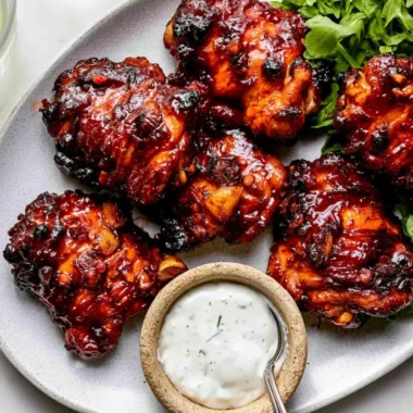 Honey Harissa Chicken dish garnished with herbs and spices